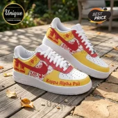 Kappa Alpha Psi custom sneakers with red and yellow leather panels, white soles, and Greek fraternity letter graphics.!