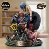 Kingdom Hearts 25th anniversary PVC figurine featuring Riku, Sora holding the Keyblade, and Kairi on a rocky base.!