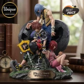 Kingdom Hearts 25th anniversary PVC statue featuring Sora, Riku, and Kairi sitting on a stone base with a brass nameplate.!