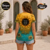Woman wearing a short-sleeve sunflower print shirt with text reading Party loud, dream big, stay wild and Rock And Roll.!