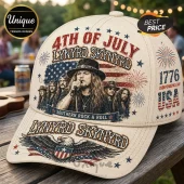 Cream-colored baseball cap with Lynyrd Skynyrd band graphic, American flag, 4th of July text, and bald eagle illustration.!