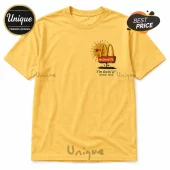Mustard yellow cotton t-shirt with a vintage McDonald's sun graphic and text reading I'm lovin' it since 1955.!