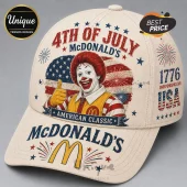 Beige baseball cap featuring Ronald McDonald with an American flag, fireworks, and text saying 4th of July and 1776 USA.!