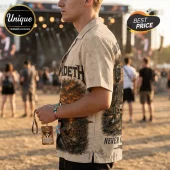 Tan short-sleeve button-down shirt featuring Megadeth band logo, skull, guitar, and microphone graphic prints.!