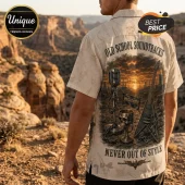 Man wearing a cream button-down shirt with a Megadeth print of a microphone, guitar, and skull against a sunset desert.!