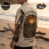 Man wearing a cream-colored short-sleeve shirt with Megadeth, skull, microphone, and guitar graphic print on the back.!