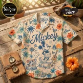 Mickey Mouse Hawaiian button-down shirt with tan base, blue palm trees, orange hibiscus flowers, and castle graphics.!