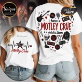 White graphic t-shirt featuring Mötley Crüe themed rock and roll icons, a skull, electric guitar, and red text print.!