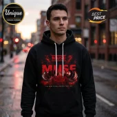 Man wearing black hoodie with Muse The Wow Signal Europa Tour 2026 red graphic print in urban city street setting.!