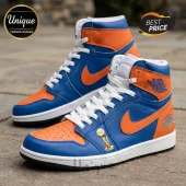 Air Jordan 1 high-top sneakers in blue and orange leather with a gold Larry O'Brien trophy charm and Knicks logo detail.!