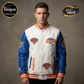 Man wearing white and blue New York Knicks varsity jacket with Champions 2026 embroidery and basketball team logos.!