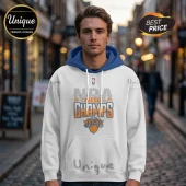 White hoodie with blue hood featuring 2026 New York Knicks NBA championship graphic, basketball icon, and front pocket.!