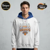 Man wearing a white hoodie with blue hood, featuring a 2026 New York Knicks NBA Champions graphic print.!