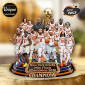 New York Knicks 2026 NBA Finals Champions commemorative display featuring player figurines and a gold trophy on a round base.!