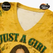 V-neck yellow fabric t-shirt with sunflower pattern and dark green text reading Just A Girl.!