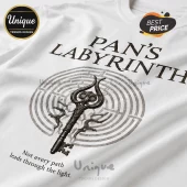 White t-shirt featuring Pan's Labyrinth text, a circular stone maze graphic, and a dark ornate metal skeleton key.!
