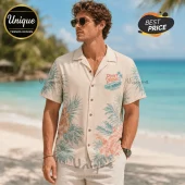 Man wearing a cream-colored short-sleeve button-down shirt with a tropical palm leaf print and Point Break graphic text.!