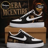 Custom Reba McEntire sneakers with black textured leather, white swoosh, and Fancy guitar graphic on a cardboard box.!