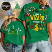 Green t-shirt featuring Wizard of Oz graphics, including Ruby Slippers, Emerald City, and text reading I have a Wizard addiction.!