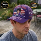 Purple baseball cap featuring a portrait of Prince, 4th of July text, American flag graphics, and the year 1776.!