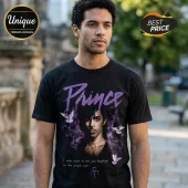 Black cotton t-shirt featuring Prince portrait, purple smoke, white doves, and text I only want to see you laughing.!