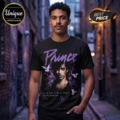 Black cotton t-shirt featuring a Prince graphic with white doves, purple smoke, and the text I only want to see you laughing.!