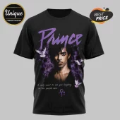 Black cotton t-shirt featuring Prince portrait, purple text logo, doves, and lyrics, isolated on grey background.!
