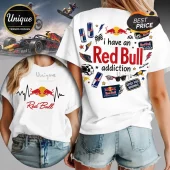 White t-shirt featuring Red Bull energy drink graphics, racing cars, helmets, and text I have an Red Bull addiction.!