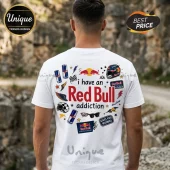 White crew neck t-shirt featuring Red Bull logo, energy drink cans, racing helmet, and text reading I have a Red Bull addiction.!
