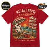 Red graphic t-shirt featuring Snoopy relaxing in a beach chair under an umbrella with beach signposts and a cooler.!