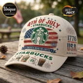 Beige baseball cap with 4th of July Starbucks graphics, American flag, coffee cups, and text 1776 Independence Day USA.!