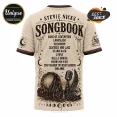 Cream-colored t-shirt featuring Stevie Nicks Songbook text, vintage microphone, tambourine, and occult iconography print.!