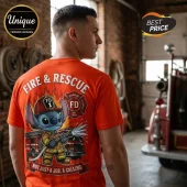 Man wearing orange t-shirt with Stitch character as firefighter, holding hose with Fire & Rescue text on back.!