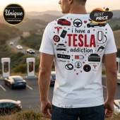 White graphic t-shirt featuring Tesla car illustrations, charging stations, red text stating I have a TESLA addiction.!
