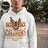 White hooded sweatshirt featuring a brown Hook 'em Horns hand sign graphic, text Back Back National Champions, and Texas map.!