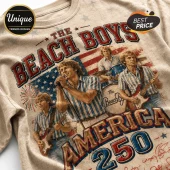 Vintage beige t-shirt featuring The Beach Boys graphic with US flag, drums, guitars, and America 250 text in red and blue.!