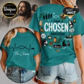 Teal t-shirt featuring Christian iconography and The Chosen series motifs including fish, scrolls, and Jesus imagery.!