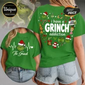 Green t-shirt featuring The Grinch heart rate graphic and back print with text I have a GRINCH addiction and icons.!