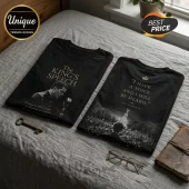 Two black cotton t-shirts featuring The King's Speech movie graphics, text quotes, and vintage imagery on a grey bedspread.!