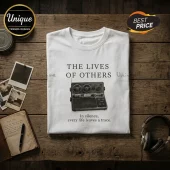 White cotton crewneck t-shirt with The Lives of Others text and a vintage reel-to-reel tape recorder graphic print.!
