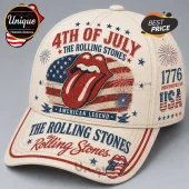 Cream-colored baseball cap with red, white, and blue Rolling Stones tongue logo, 4th of July text, and American flag print.!