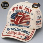 Off-white baseball cap featuring 4th of July text, Rolling Stones tongue logo, US flag, and Independence Day graphics.!