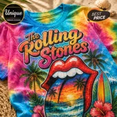 The Rolling Stones t-shirt with tie-dye blue, pink, and yellow fabric featuring a beach sunset logo and surfboard graphic.!