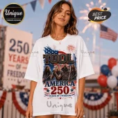 White oversized t-shirt featuring a Tool band graphic, American flag motifs, and text reading America 250 Years of Freedom.!