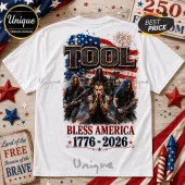White t-shirt featuring the band Tool, US flag, fireworks, and text Bless America 1776-2026 on the back.!