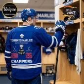 Toronto Marlies hockey jersey with 2026 champions graphic, worn by a player in a blue helmet inside a locker room.!