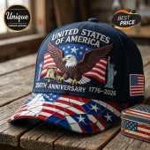 Navy blue baseball cap with embroidered bald eagle, Liberty Bell, Statue of Liberty, and mosaic flag pattern on brim.!