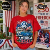 Woman wearing red t-shirt with VW bus, VW beetle, American flag, and America 250 text graphic on a front porch.!