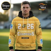 Yellow Hurricanes rugby hoodie with 2026 Champions text, black hood, and Super Rugby Pacific logos on sleeves.!