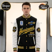 Black and white Hurricanes rugby varsity jacket with yellow gold accents, 2026 championship patches, and striped cuffs.!